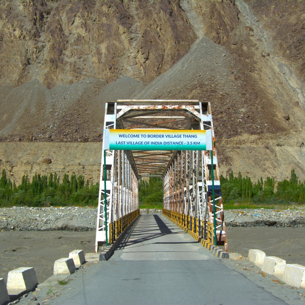 the thang bridge which is the gateway and the only motorable bridge to thang village , just half a KM away from thang village